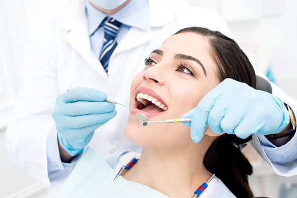 patient smiling while visiting dentist 